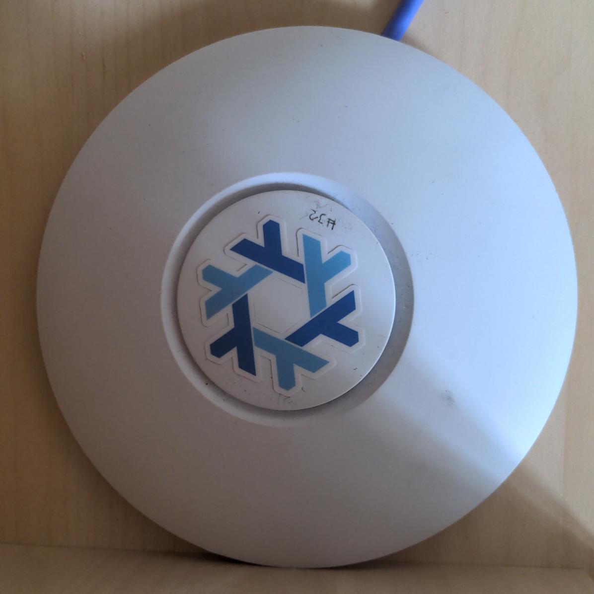 Unifi AP AC-Lite decorated with a Nix sticker